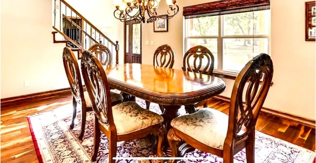 dining room featuring a notable chandelier and hardwood / wood-style flooring