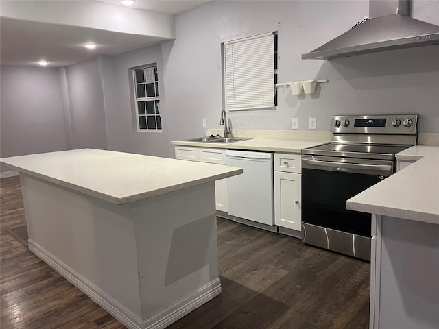 kitchen with stainless steel range with electric stovetop, dishwasher, sink, white cabinetry, and extractor fan