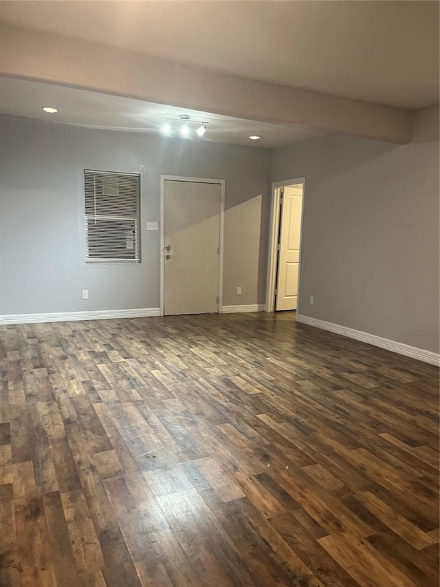 10434 S Burman St, Houston, TX 77029 - empty room featuring dark wood-type flooring, recessed lighting, and baseboards