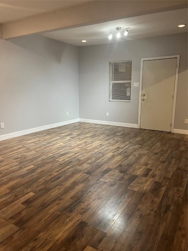 10434 S Burman St, Houston, TX 77029 - empty room featuring dark wood finished floors, baseboards, and recessed lighting