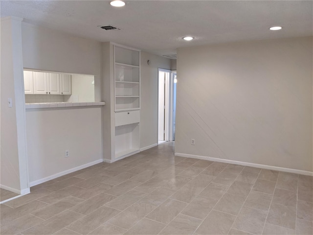 view of tiled spare room