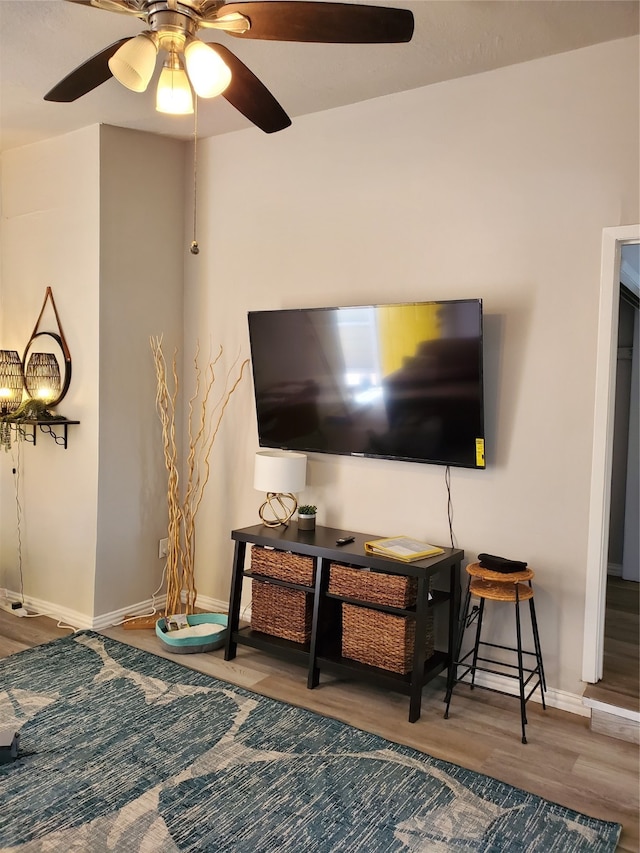 interior space featuring hardwood / wood-style floors and ceiling fan