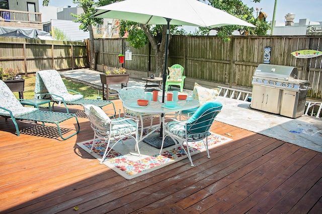 wooden terrace with a grill