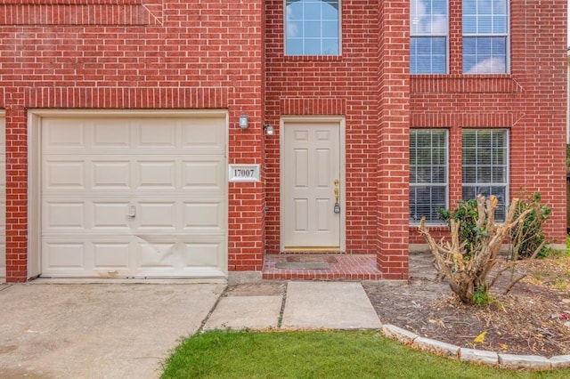 view of exterior entry featuring a garage