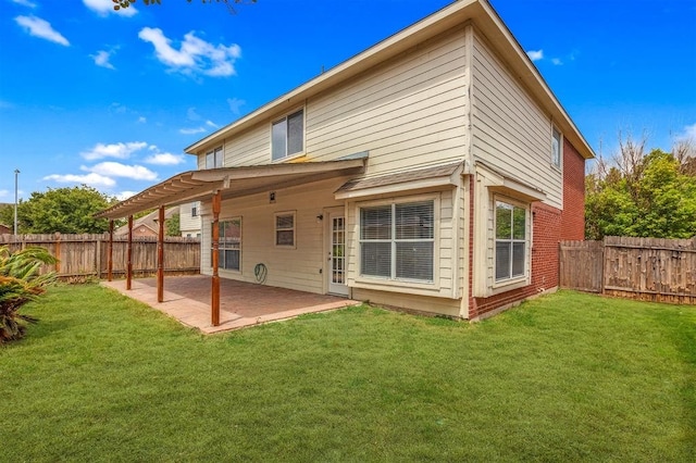 back of house with a patio area, a pergola, and a yard