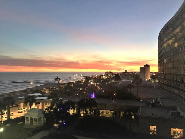 city view featuring a view of the beach and a water view