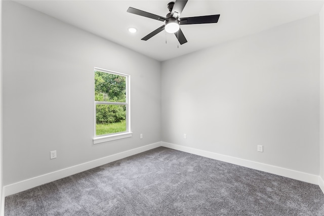 empty room featuring ceiling fan and carpet floors