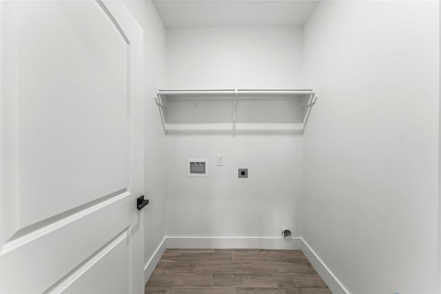 washroom with hookup for an electric dryer, dark hardwood / wood-style floors, and hookup for a washing machine