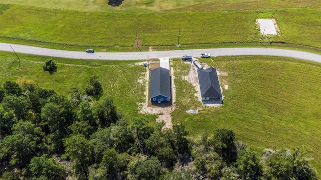 birds eye view of property with a rural view