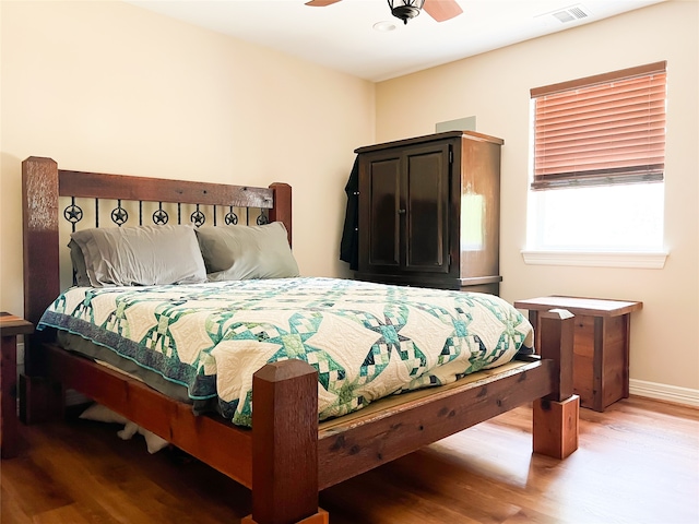 bedroom featuring ceiling fan and hardwood / wood-style flooring