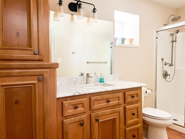 bathroom featuring a shower with door, wood-type flooring, toilet, and vanity