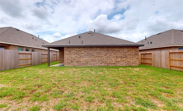 back of property with a yard