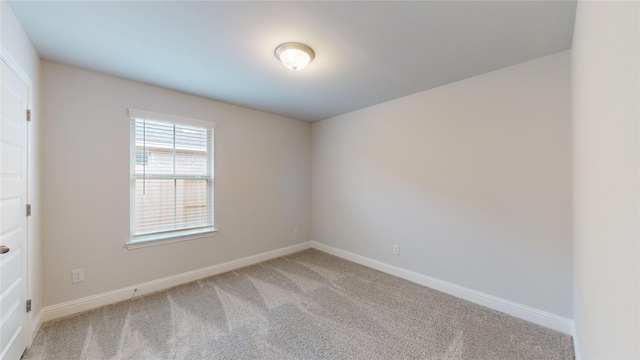 empty room featuring carpet floors