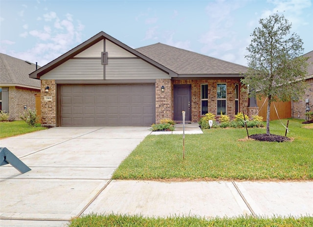 view of front of property with a garage and a front yard