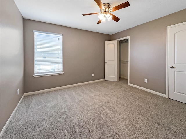 unfurnished bedroom with light carpet, a closet, and ceiling fan