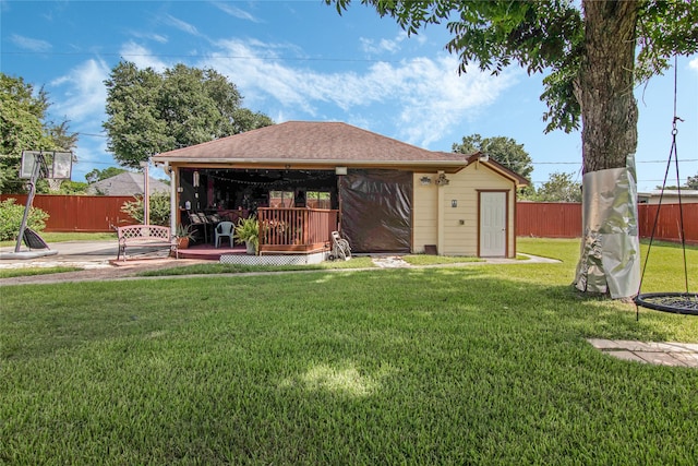 view of yard featuring an outdoor structure and a wooden deck