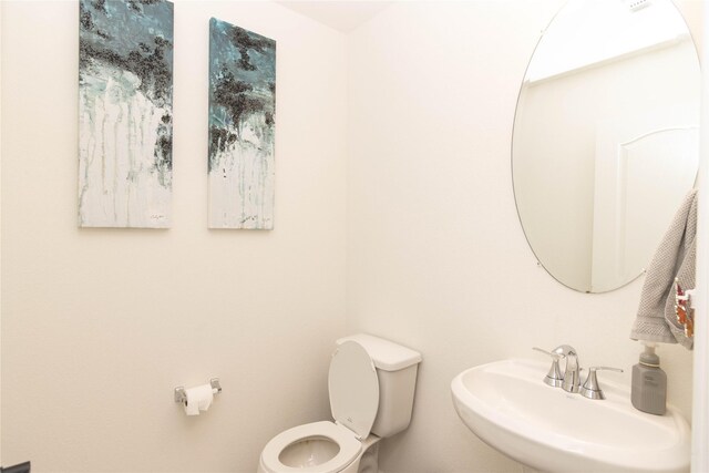 bathroom with sink and toilet