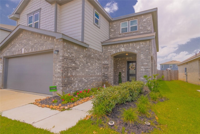 view of front facade featuring a garage and a front yard