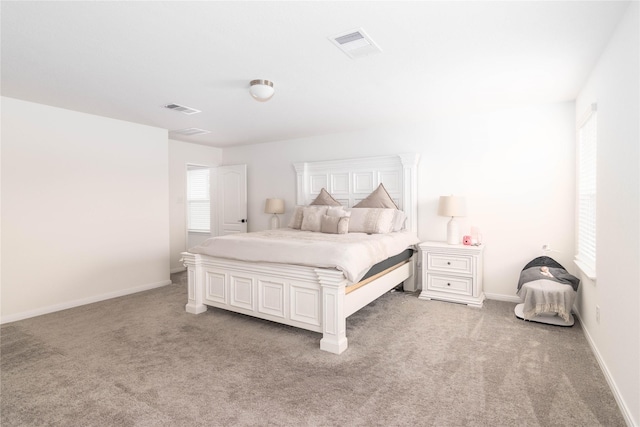 unfurnished bedroom featuring light carpet