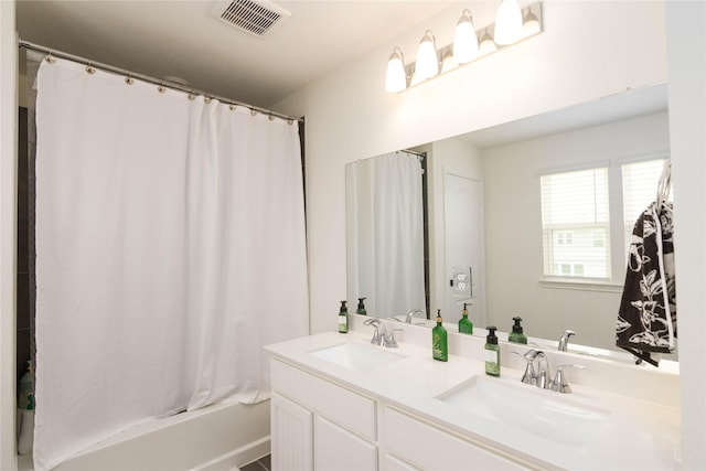 bathroom featuring vanity and shower / bathtub combination with curtain