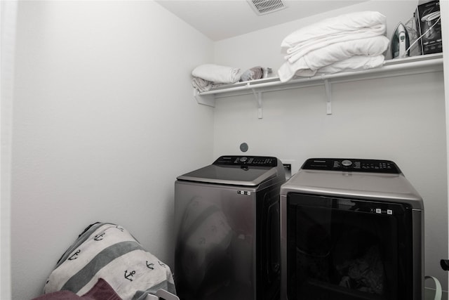 laundry room with washer and dryer