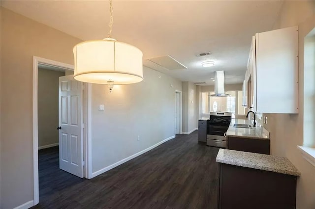 kitchen featuring light stone counters, dark hardwood / wood-style flooring, island range hood, stainless steel range, and sink