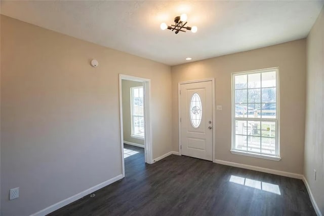 foyer with dark hardwood / wood-style floors