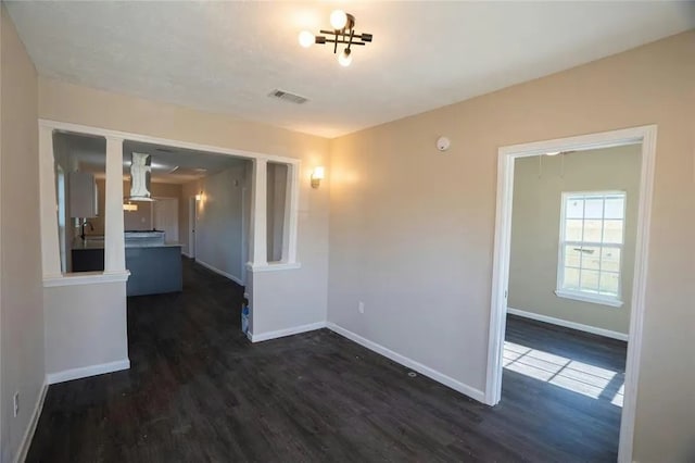 empty room with dark hardwood / wood-style floors