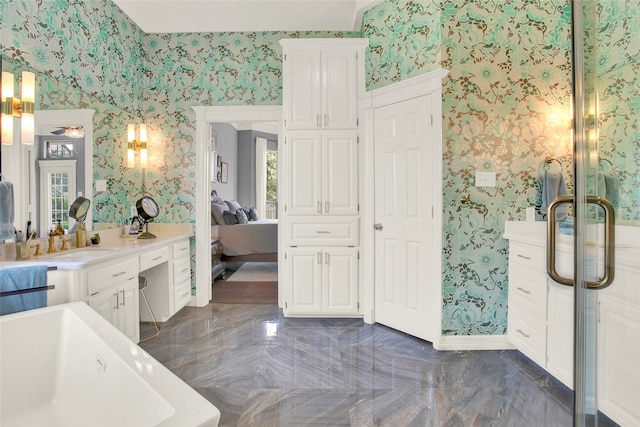 bathroom with vanity and a bathtub