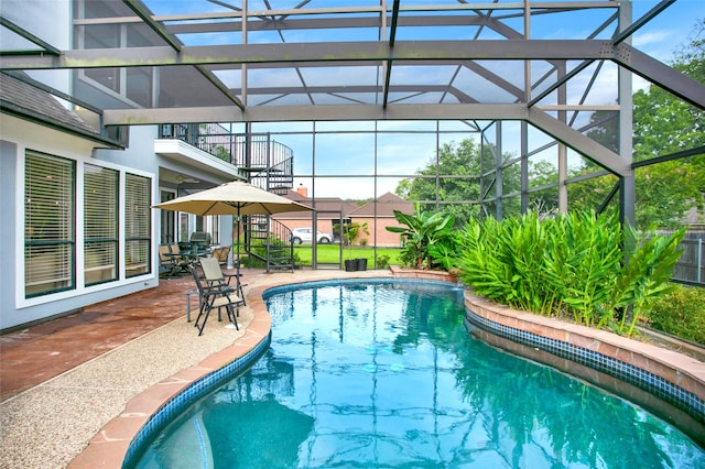 view of pool featuring a lanai and a patio area