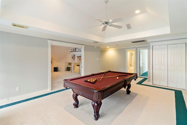 recreation room with ornamental molding, light colored carpet, a tray ceiling, ceiling fan, and pool table