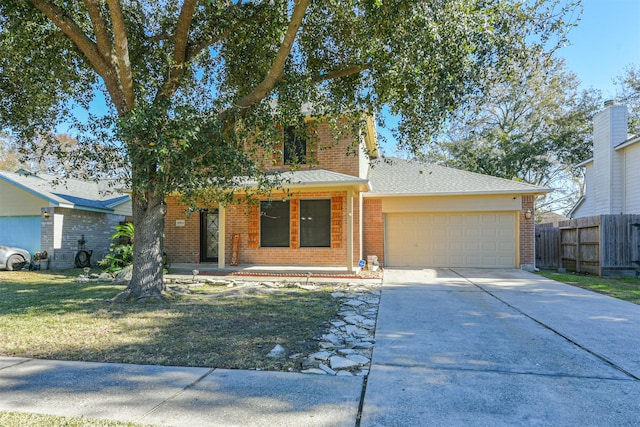 view of front of house featuring a garage and a front yard