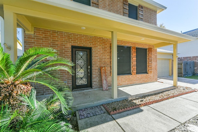 view of exterior entry featuring a garage