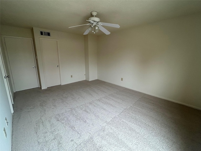 unfurnished bedroom with carpet and ceiling fan