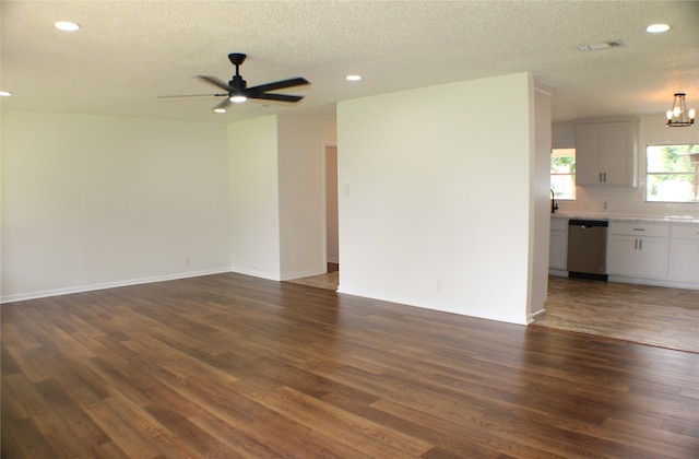 spare room featuring tile flooring, sink, a textured ceiling, and ceiling fan with notable chandelier