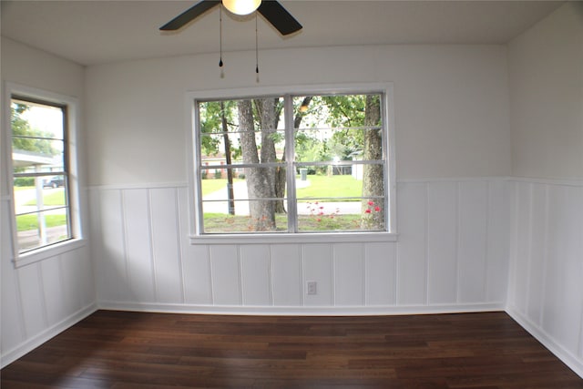 empty room featuring ceiling fan and dark hardwood / wood-style flooring