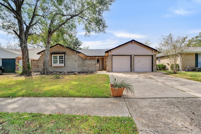 ranch-style home with a front lawn and a garage