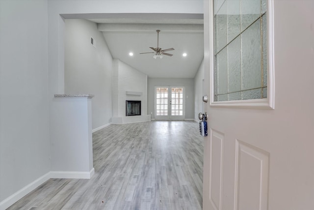 6218 Sunnygate Dr, Spring, TX 77373 - unfurnished living room featuring wood finished floors, visible vents, ceiling fan, a brick fireplace, and baseboards