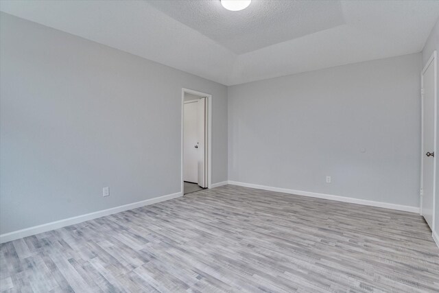 6218 Sunnygate Dr, Spring, TX 77373 - unfurnished room with light wood finished floors, a textured ceiling, and baseboards