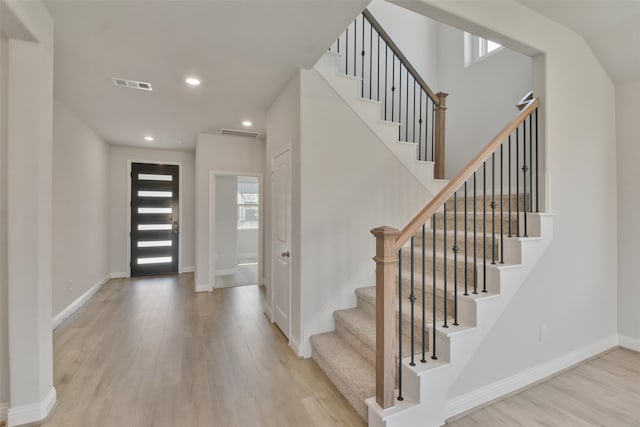 foyer with light hardwood / wood-style floors