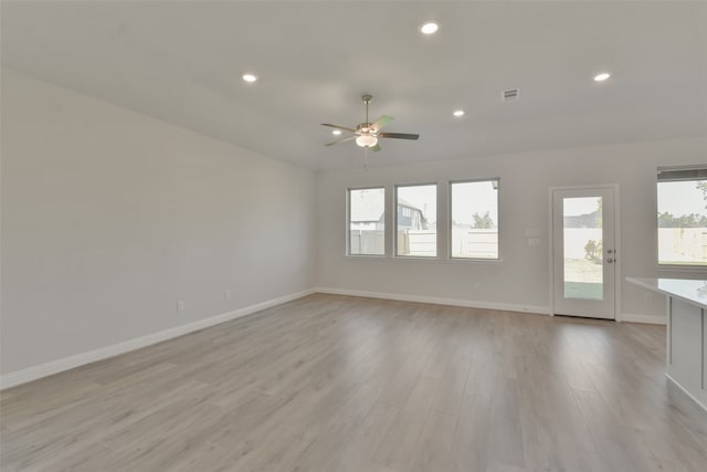 spare room featuring ceiling fan and light wood-type flooring