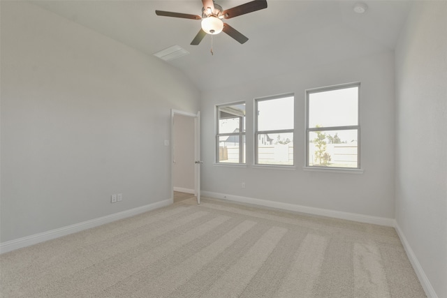 carpeted empty room featuring lofted ceiling and ceiling fan