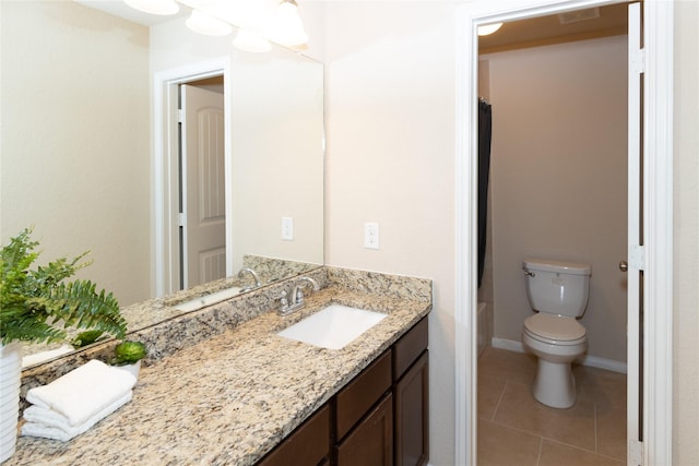 bathroom with toilet, vanity, tile patterned floors, and curtained shower