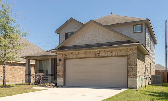 craftsman inspired home featuring a front yard and central AC unit