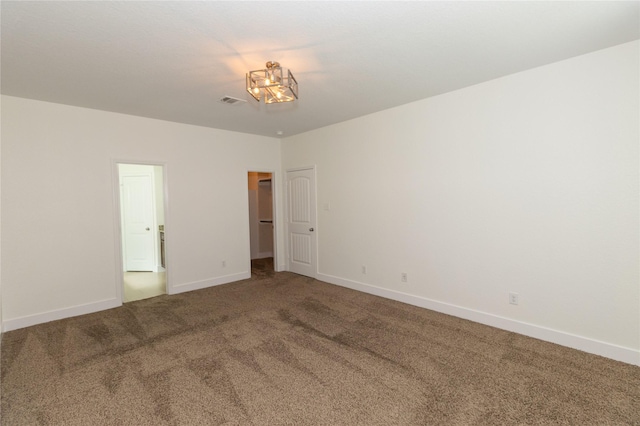 unfurnished room with carpet flooring