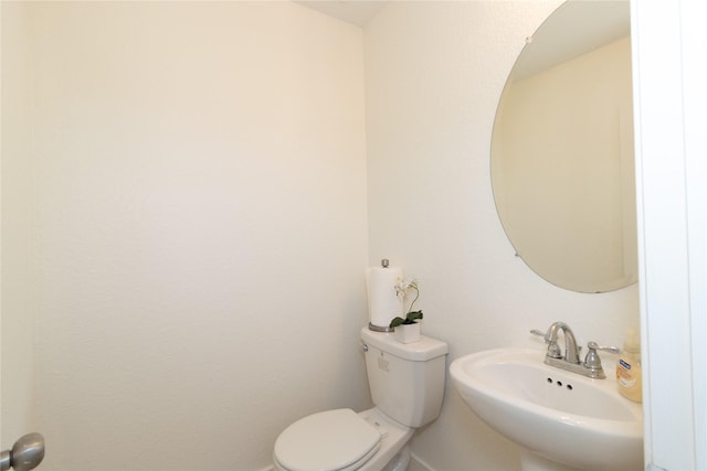 bathroom featuring sink and toilet