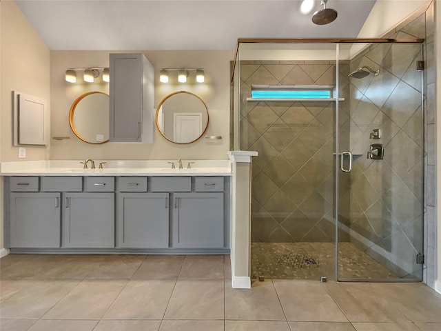 bathroom featuring tile patterned floors, vanity, and an enclosed shower