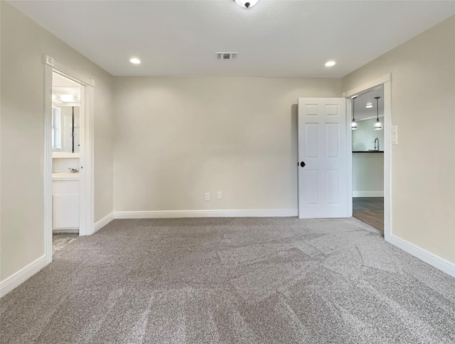 unfurnished room with carpet floors