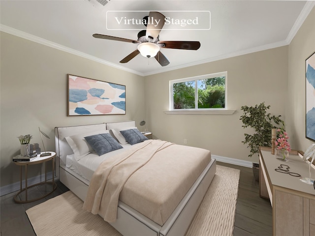 bedroom featuring hardwood / wood-style flooring, crown molding, and ceiling fan