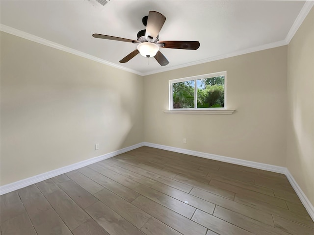 empty room featuring wood-type flooring, ornamental molding, and ceiling fan